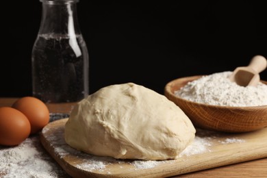 Cooking scones with soda water. Dough and ingredients on wooden table, closeup