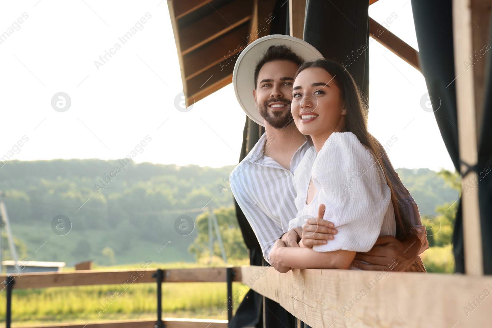Photo of Romantic date. Beautiful couple spending time together outdoors, space for text