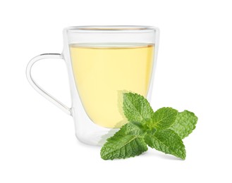 Green tea in glass cup and green leaves isolated on white