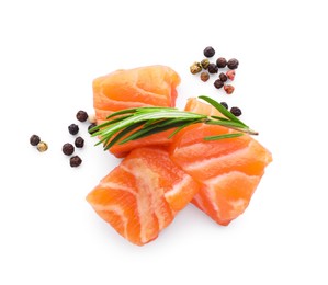 Pieces of fresh raw salmon and spices on white background, top view