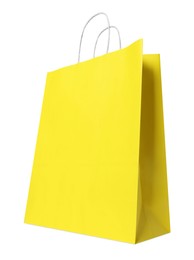 Photo of Yellow gift paper bag on white background