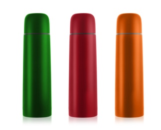Image of Set of modern thermoses in different colors on white background 
