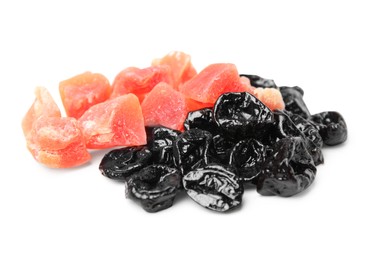 Tasty dried prunes and candied fruits on white background