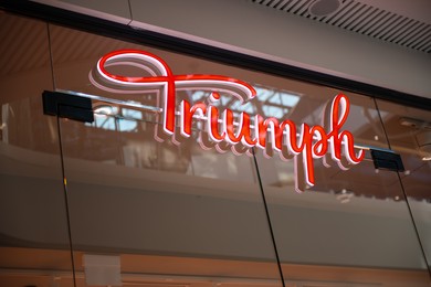 Photo of WARSAW, POLAND - AUGUST 05, 2022: Signboard of Triumph underwear store in shopping mall