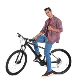 Photo of Handsome young man with modern bicycle on white background