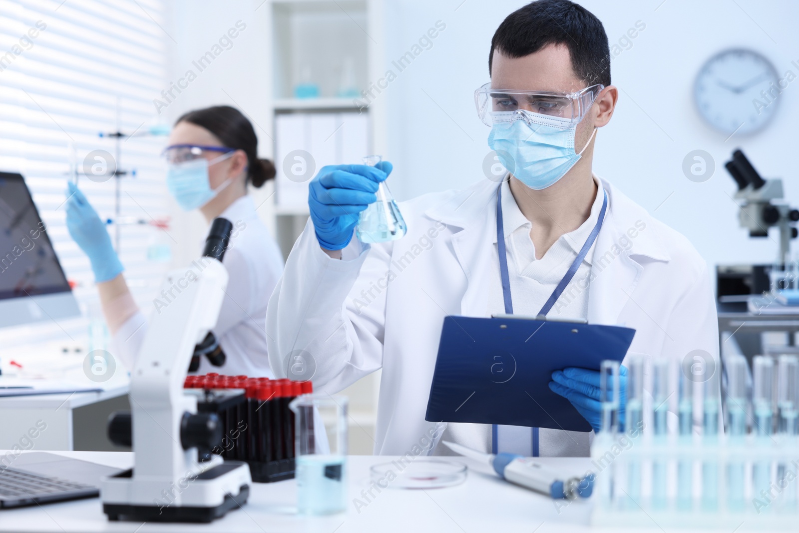 Photo of Scientists working with samples in laboratory. Medical research