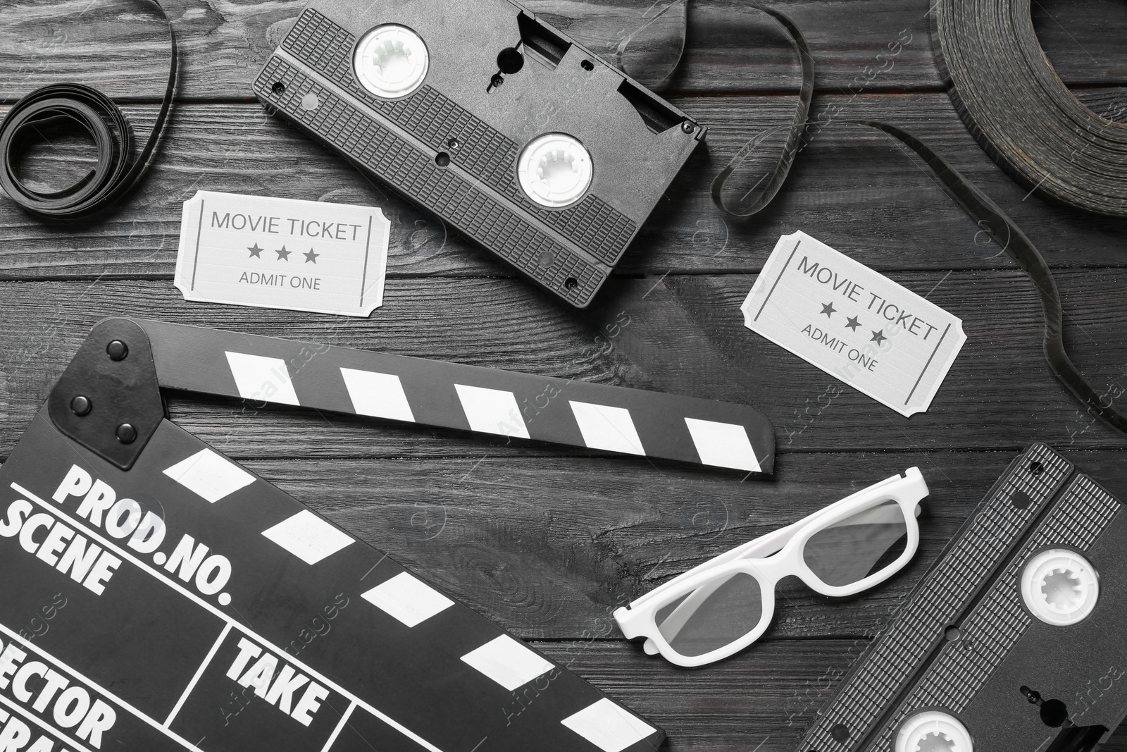 Photo of Flat lay composition with cinema entertainment items on black wooden background