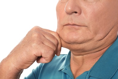 Mature man with double chin on white background, closeup