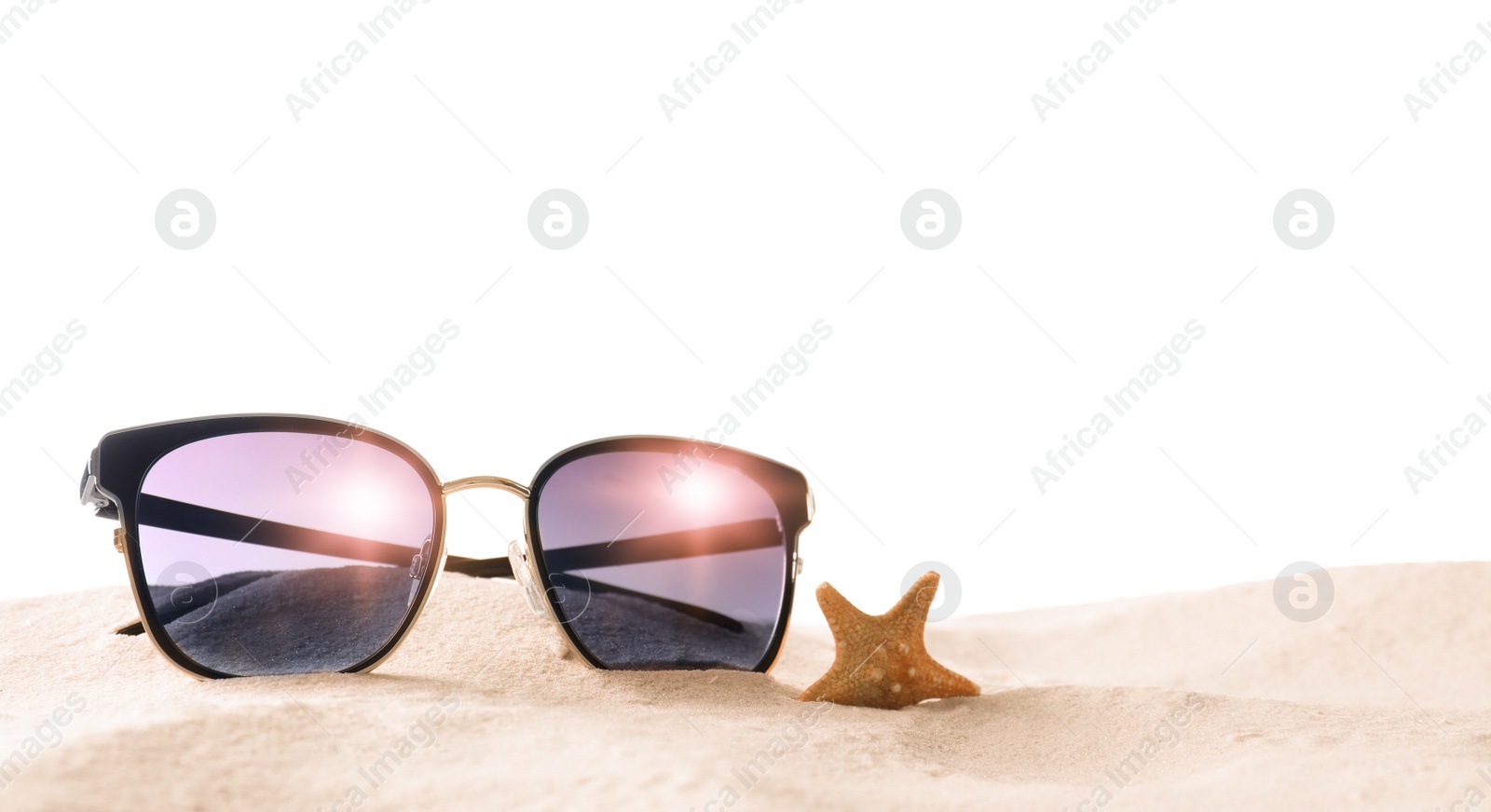 Photo of Stylish sunglasses and starfish on sand against white background. Space for text
