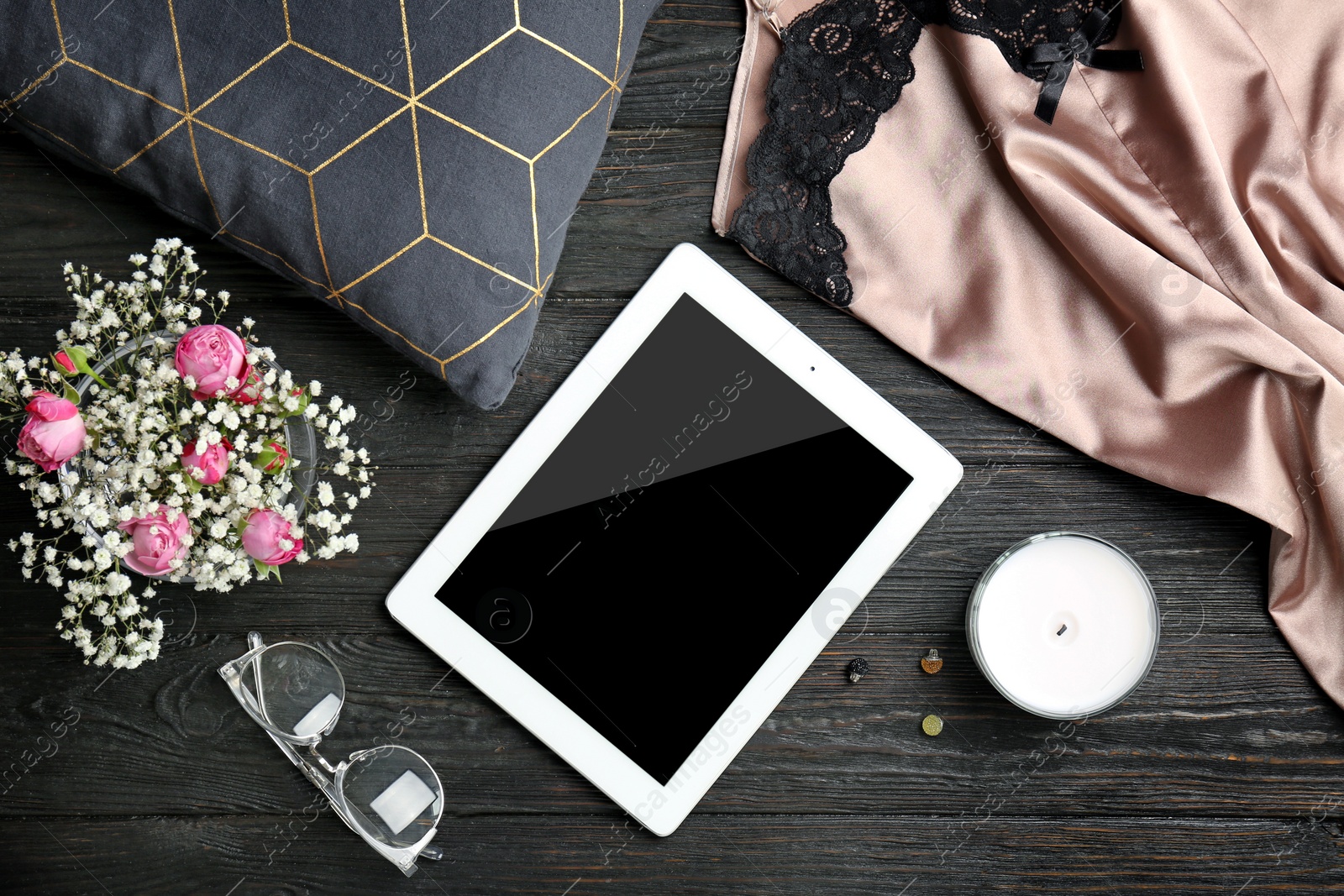 Photo of Flat lay composition with tablet and stylish clothes on wooden background. Blogger concept