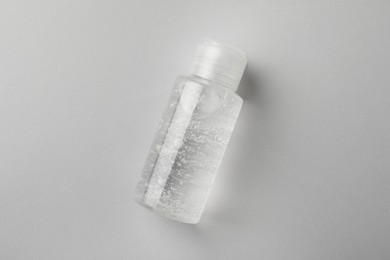 Bottle of cosmetic gel on white background, top view