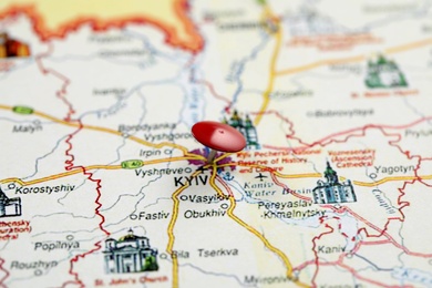 MYKOLAIV, UKRAINE - NOVEMBER 09, 2020: Kyiv city marked with push pin on map of Ukraine, closeup