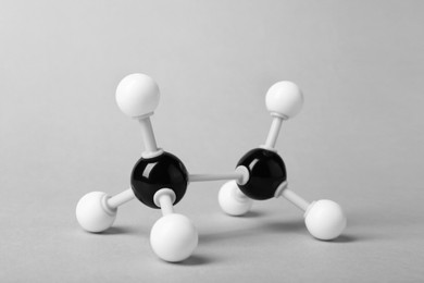 Photo of Molecule of alcohol on light grey background. Chemical model