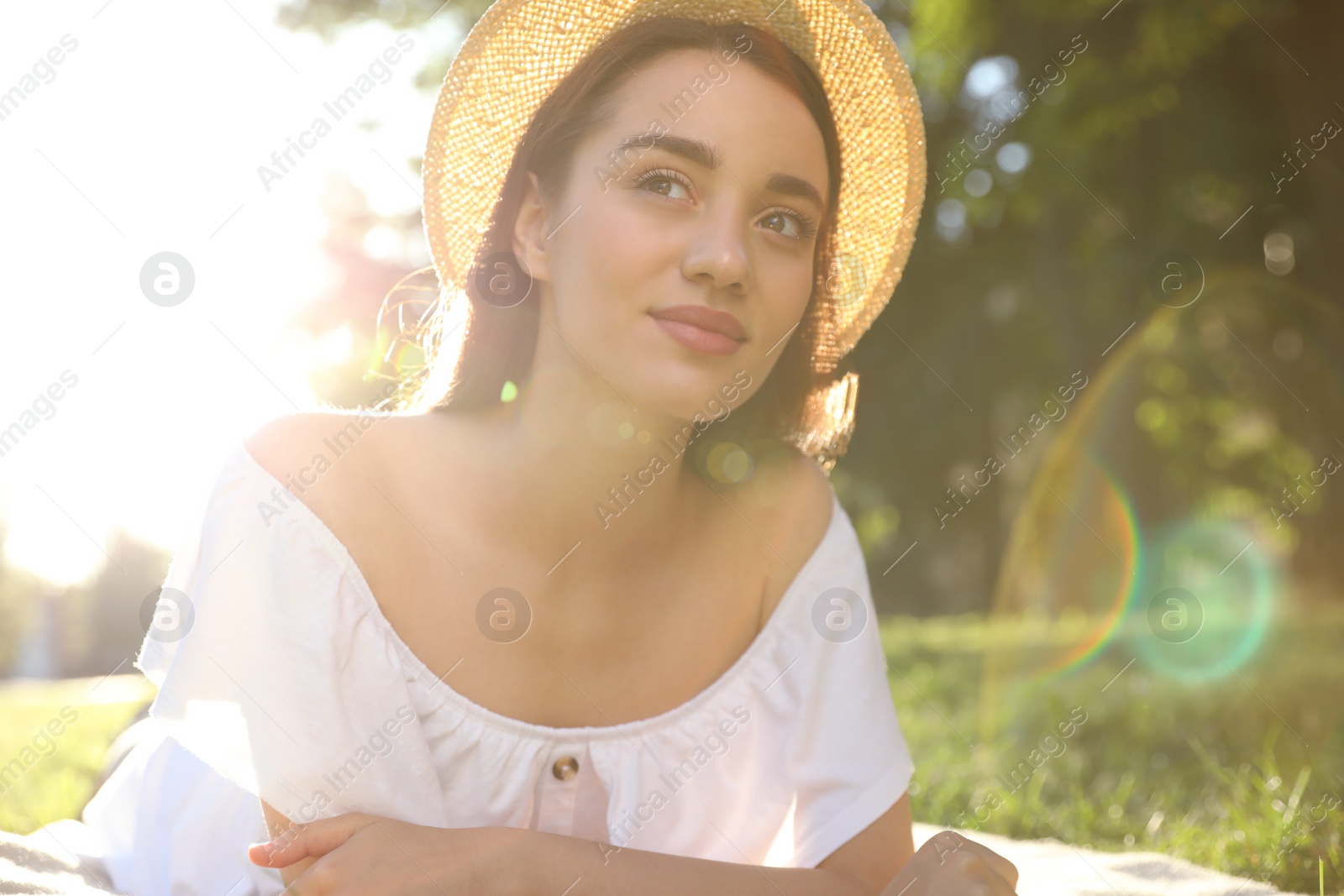 Photo of Beautiful young woman in park on sunny day