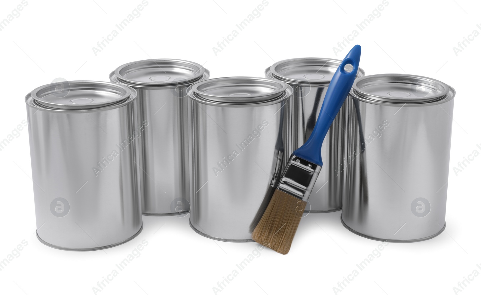 Photo of Cans of paints and brush on white background