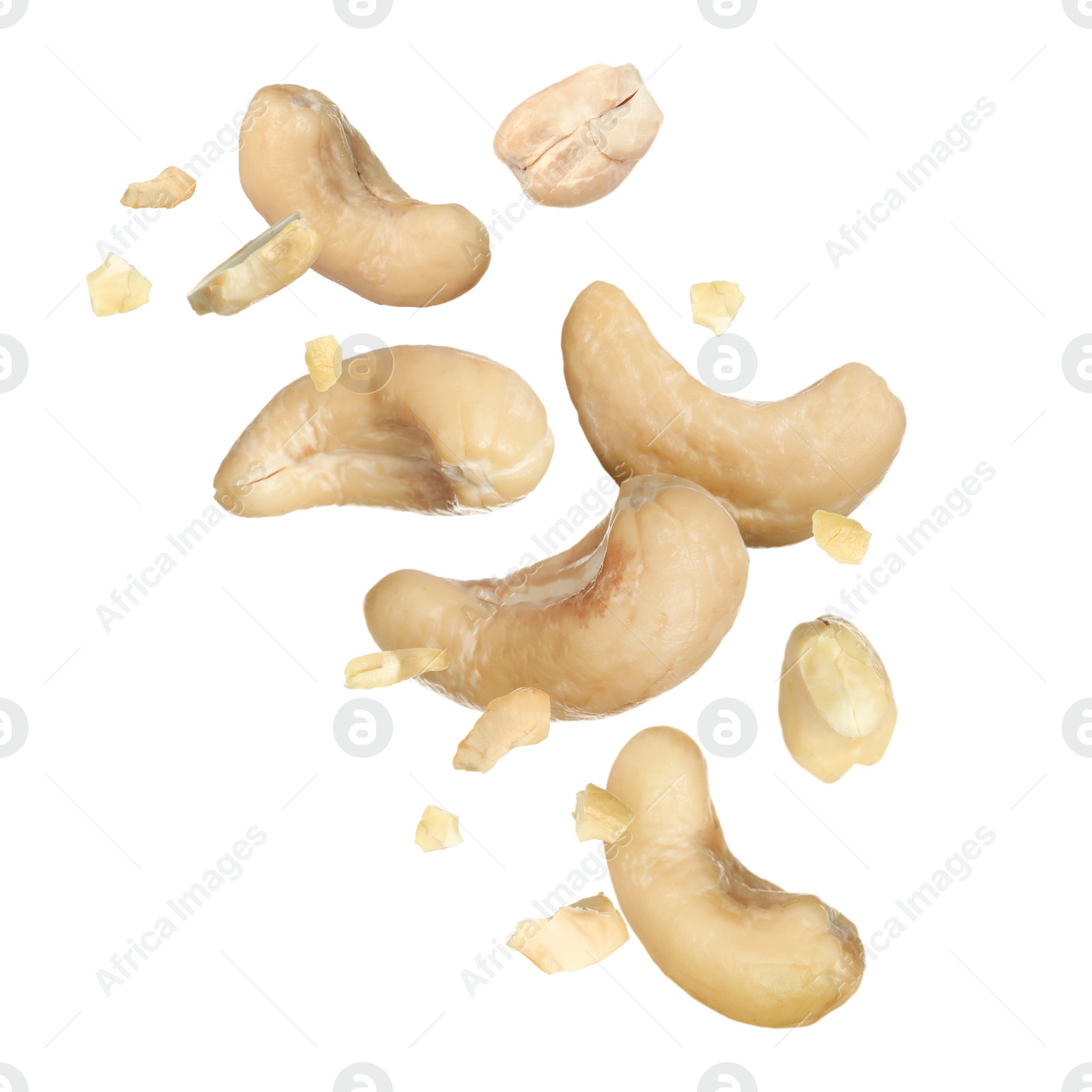 Image of Tasty cashew nuts flying on white background