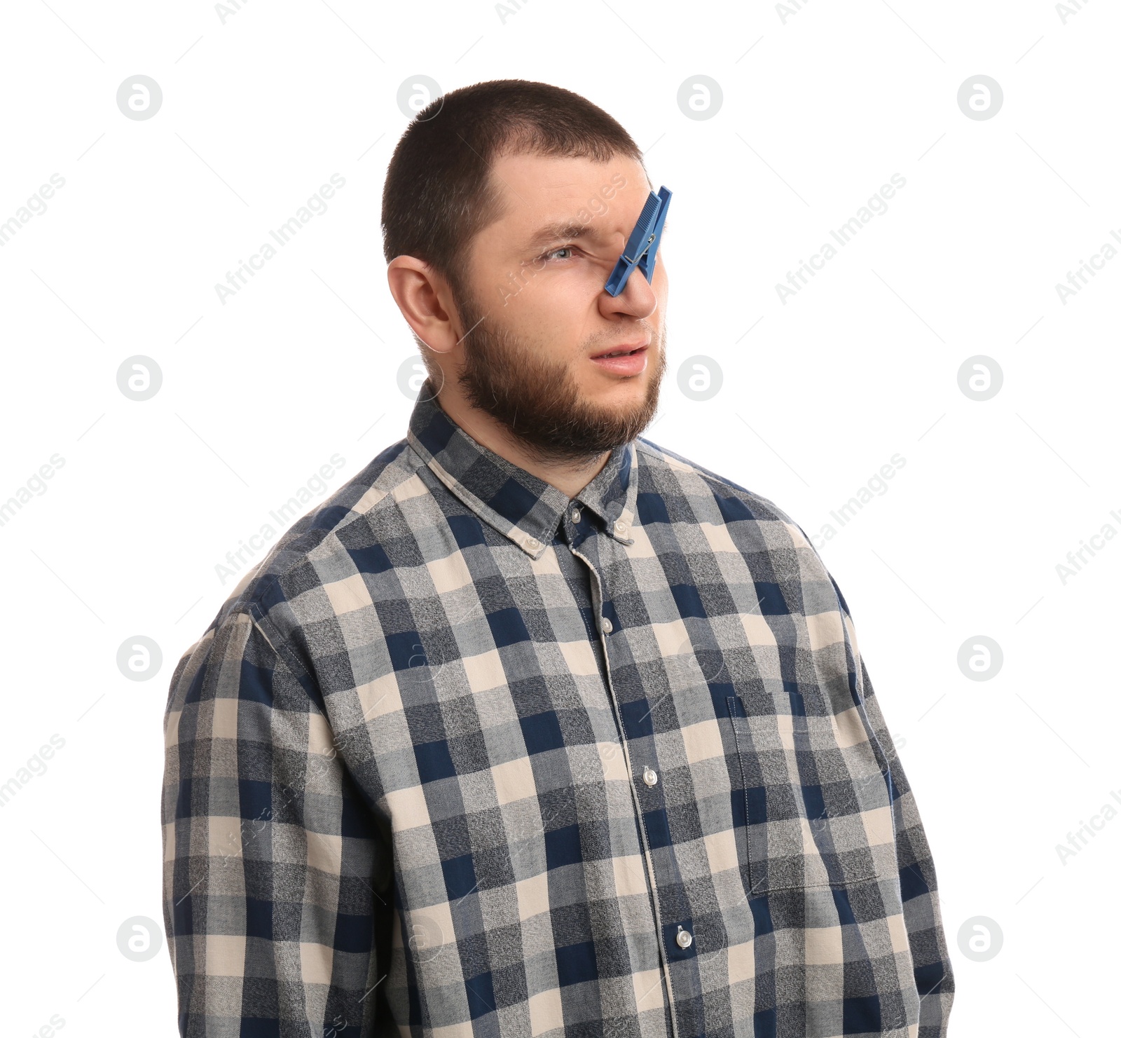 Photo of Man with clothespin on white background. Runny nose concept