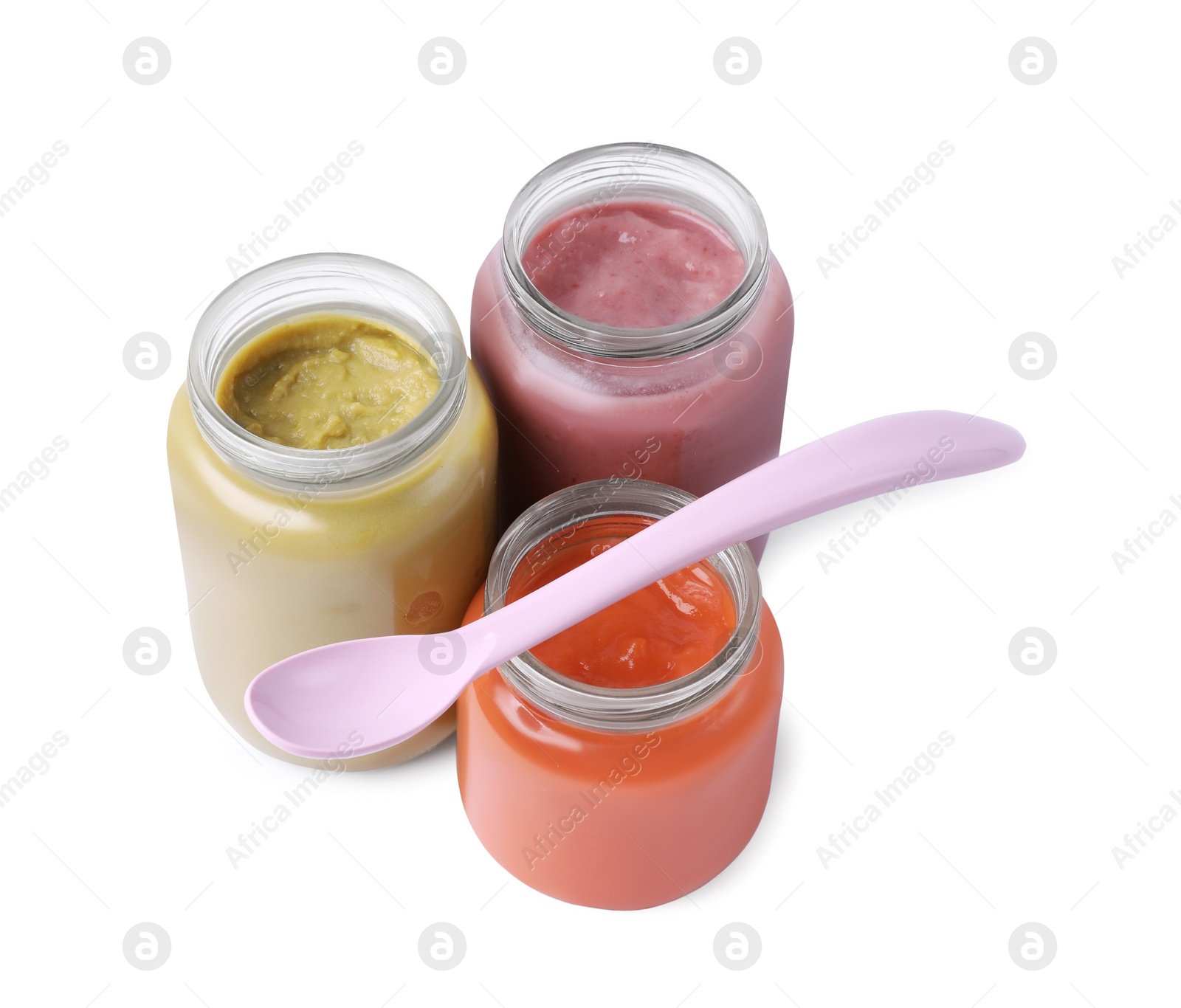 Photo of Glass jars with healthy baby food and spoon isolated on white