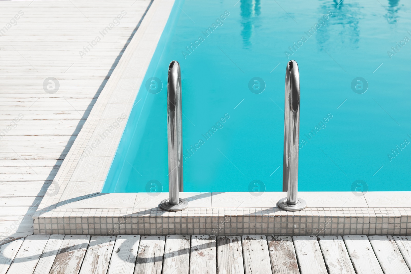 Photo of Modern swimming pool with ladder at resort