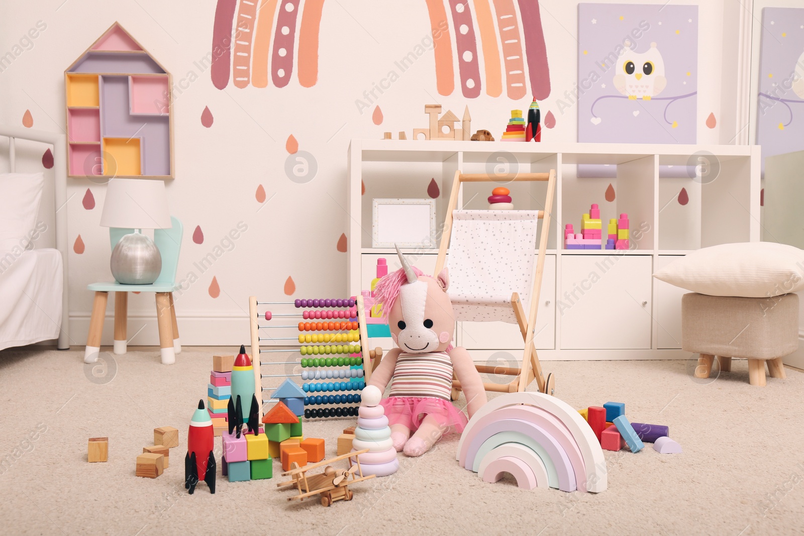 Photo of Many different toys on floor in child's room