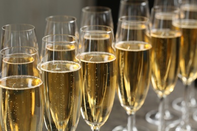 Many glasses of champagne on table, closeup