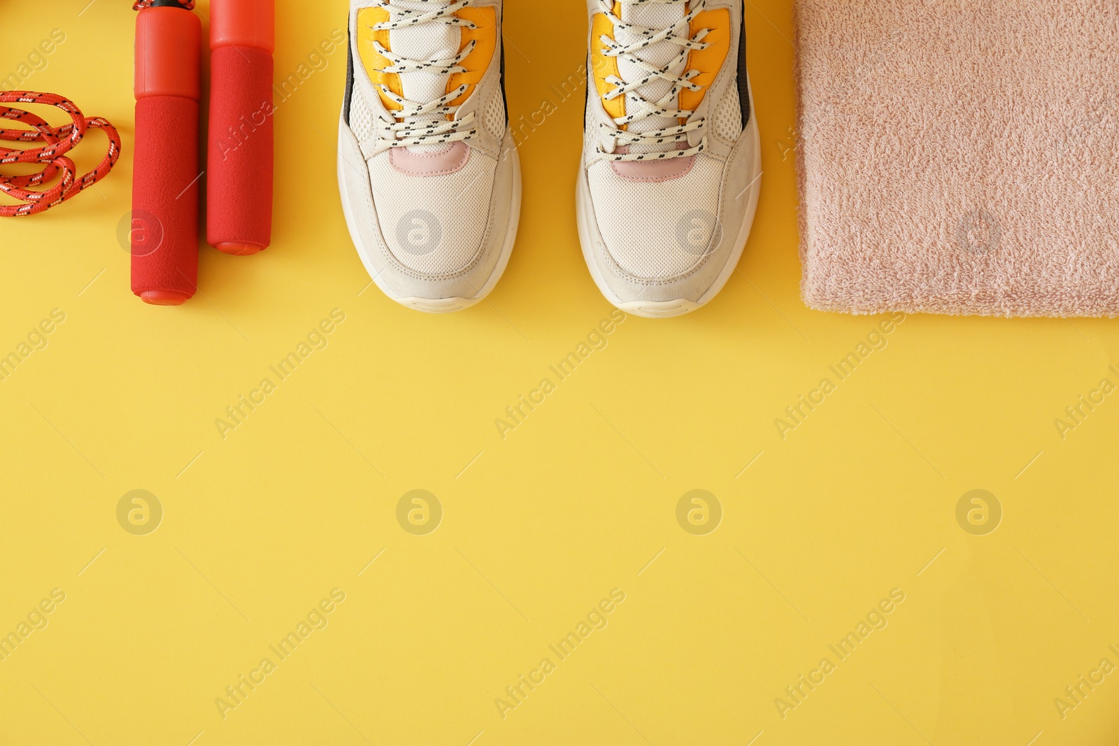 Photo of Flat lay composition with fitness equipment and space for text on color background