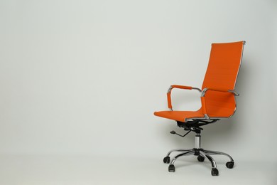 Comfortable office chair on white background, space for text