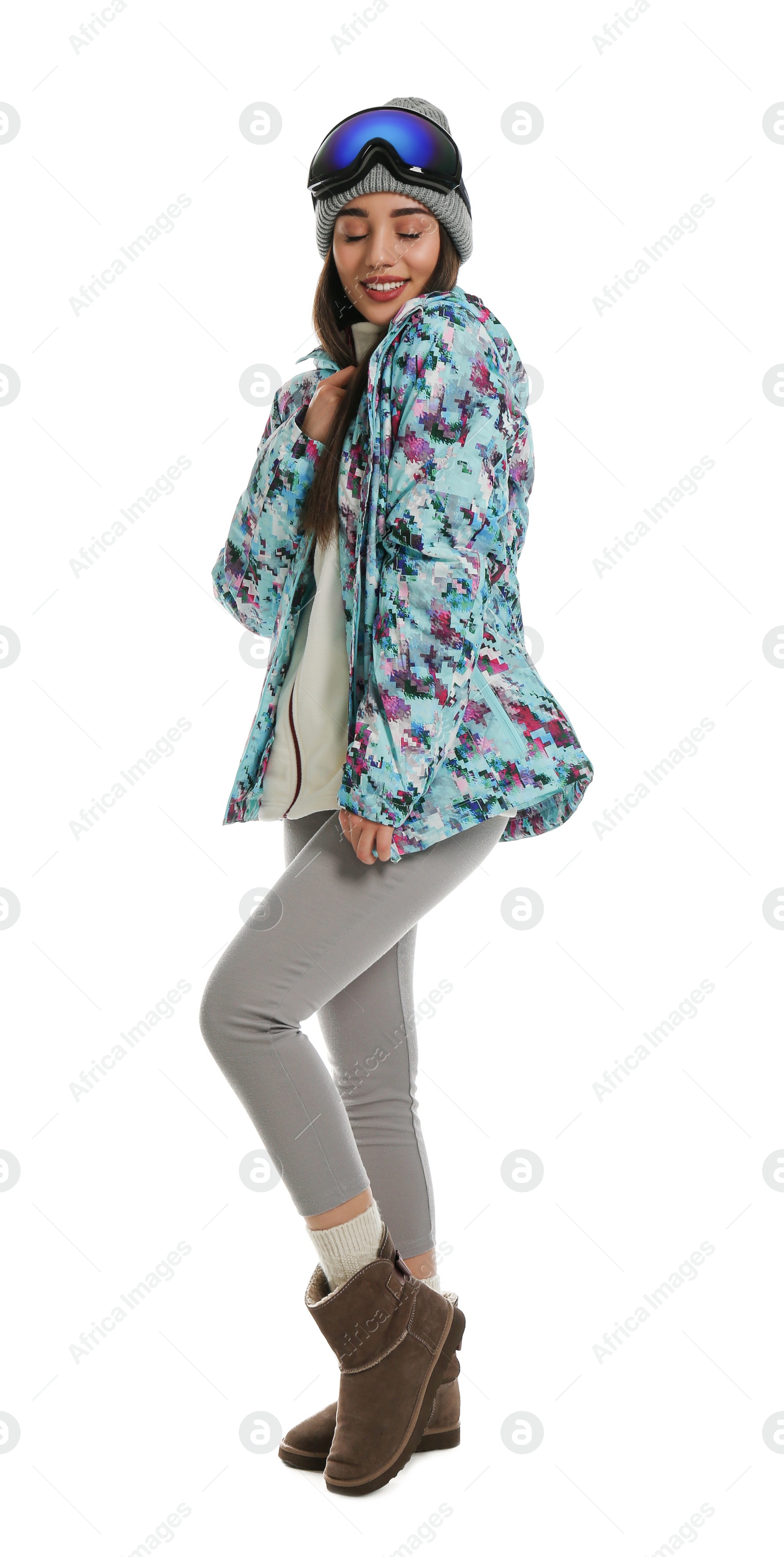 Photo of Woman wearing stylish winter sport clothes on white background