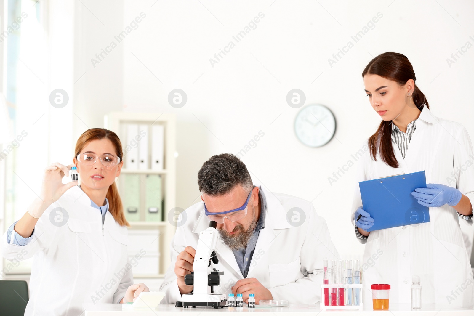 Photo of Scientists working in laboratory. Research and analysis