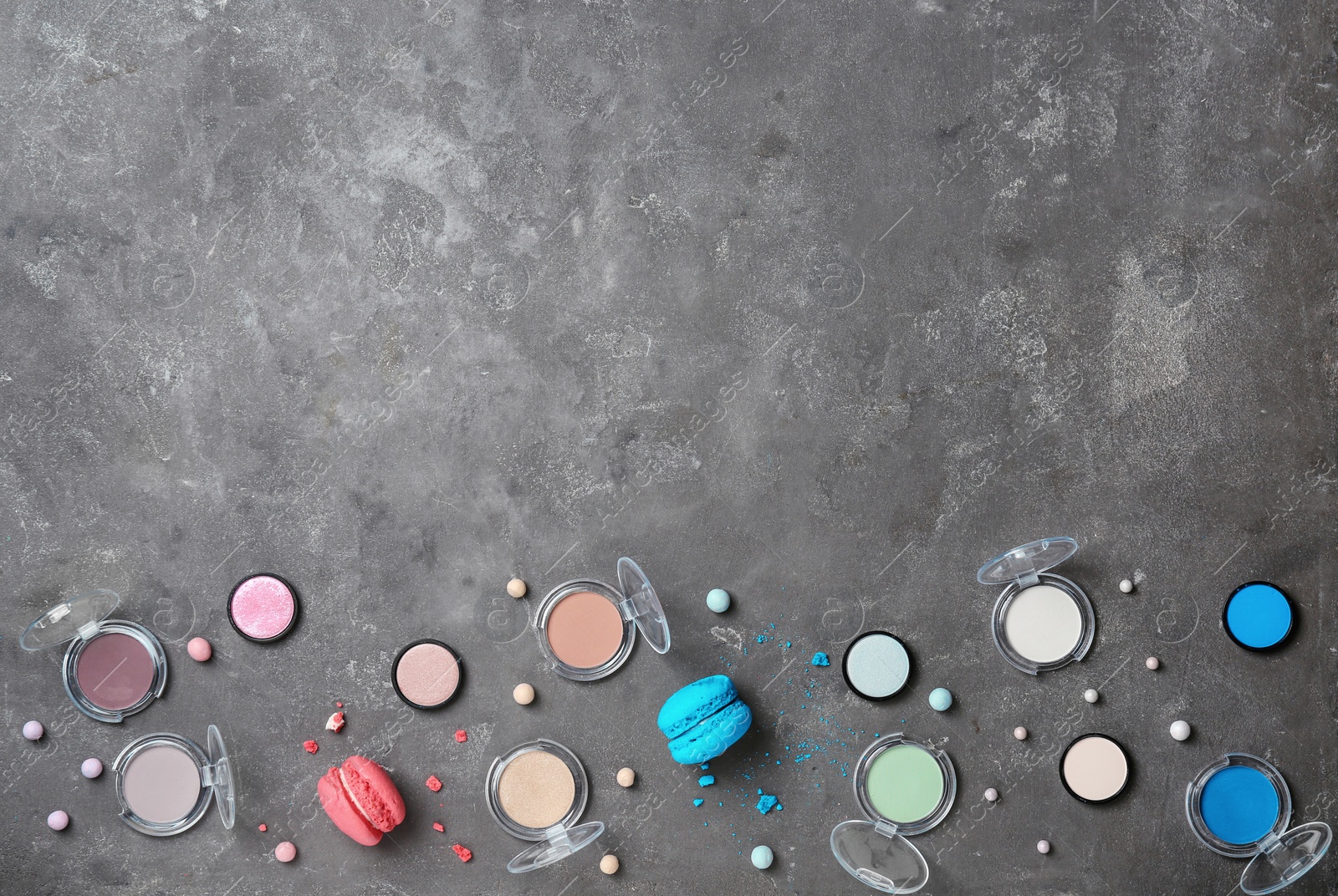 Photo of Flat lay composition with professional makeup products on grey background