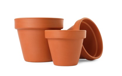 Photo of Empty clay flower pots isolated on white