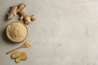 Flat lay composition with fresh and dry ginger on light grey table. Space for text