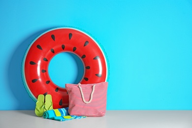 Photo of Beach objects near color wall with space for design. Summer vacation