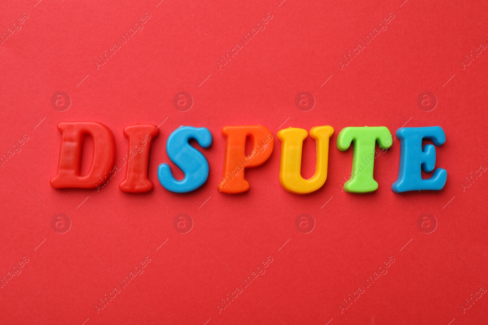 Photo of Word Dispute made of colorful letters on red background, flat lay