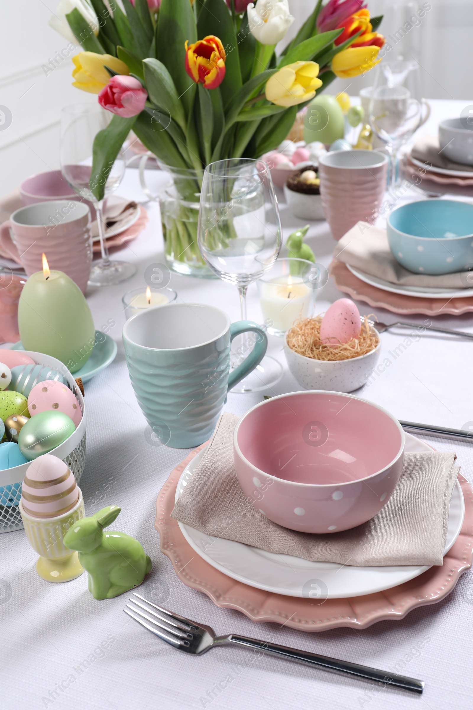 Photo of Festive table setting with beautiful flowers. Easter celebration