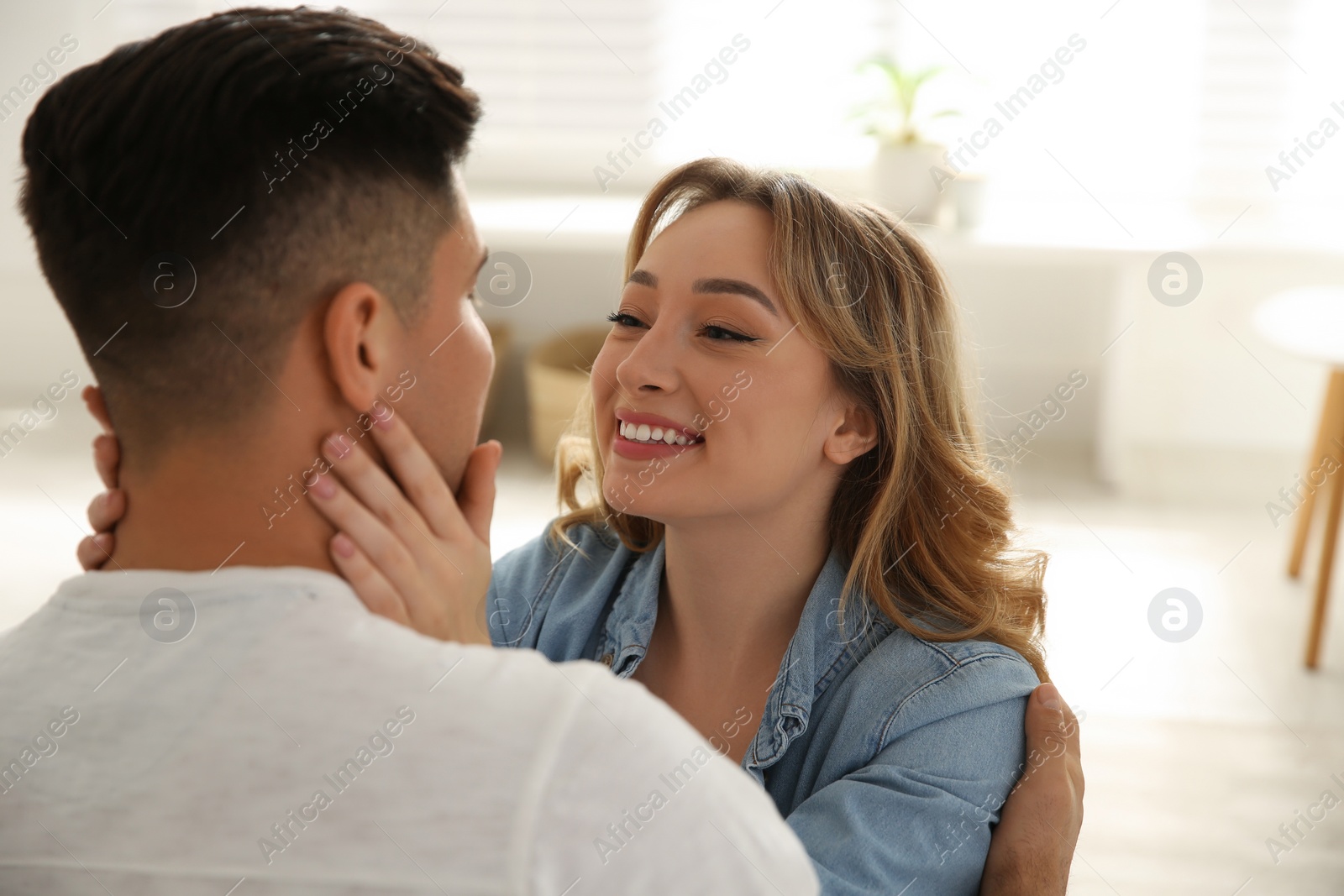 Photo of Lovely couple enjoying time together at home