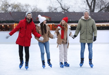 Image of Group of friends at outdoor ice rink