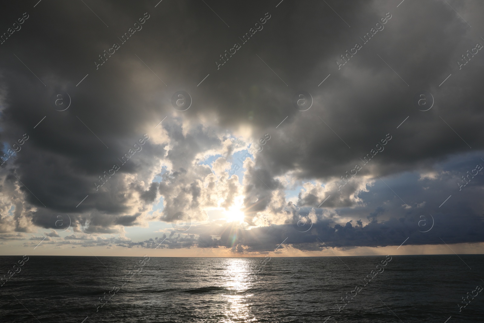 Photo of Picturesque view of sky with heavy rainy clouds over sea