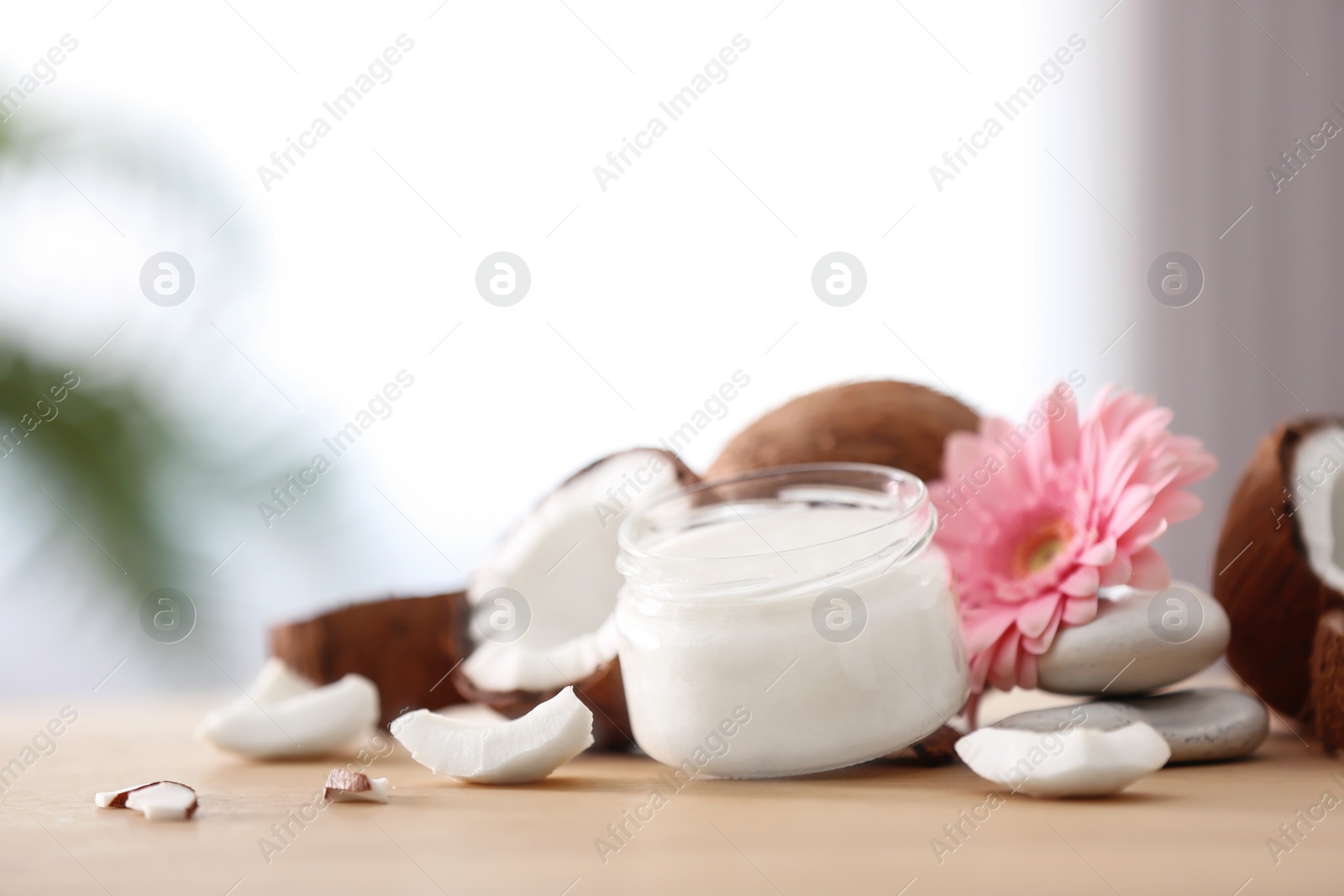 Photo of Composition with coconut butter in glass jar on blurred background