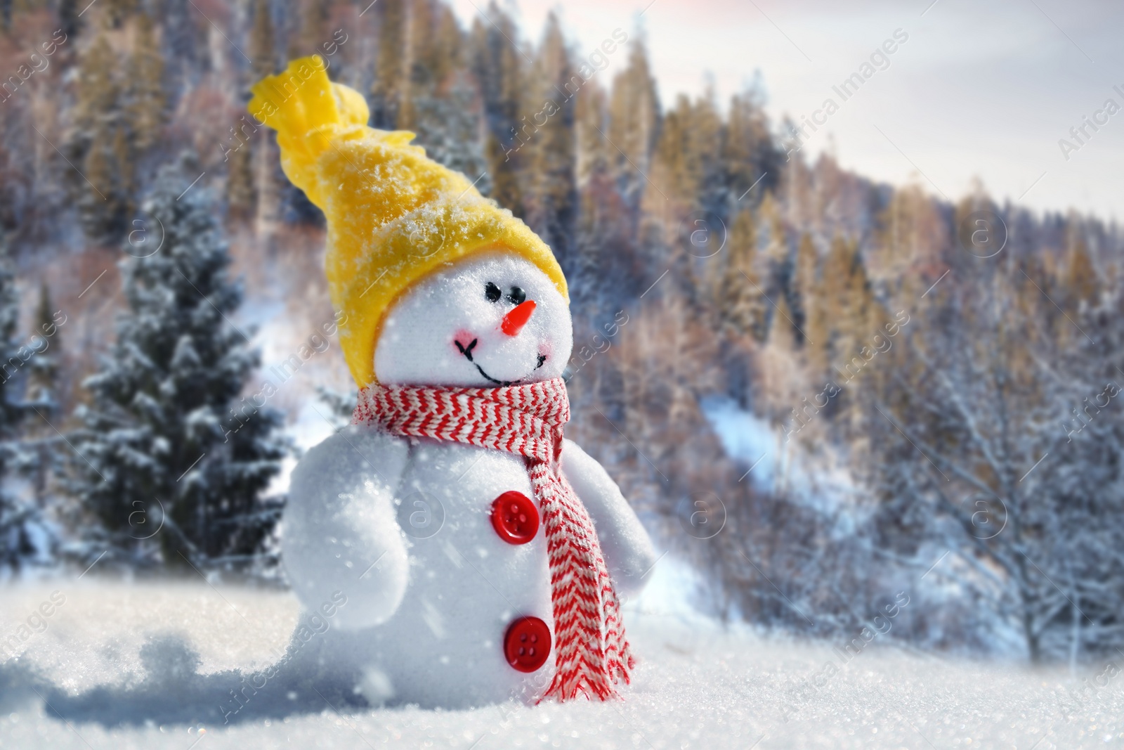 Image of Cute small decorative snowman outdoors on sunny day, space for text