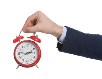 Photo of Businessman holding alarm clock on white background, closeup. Time management