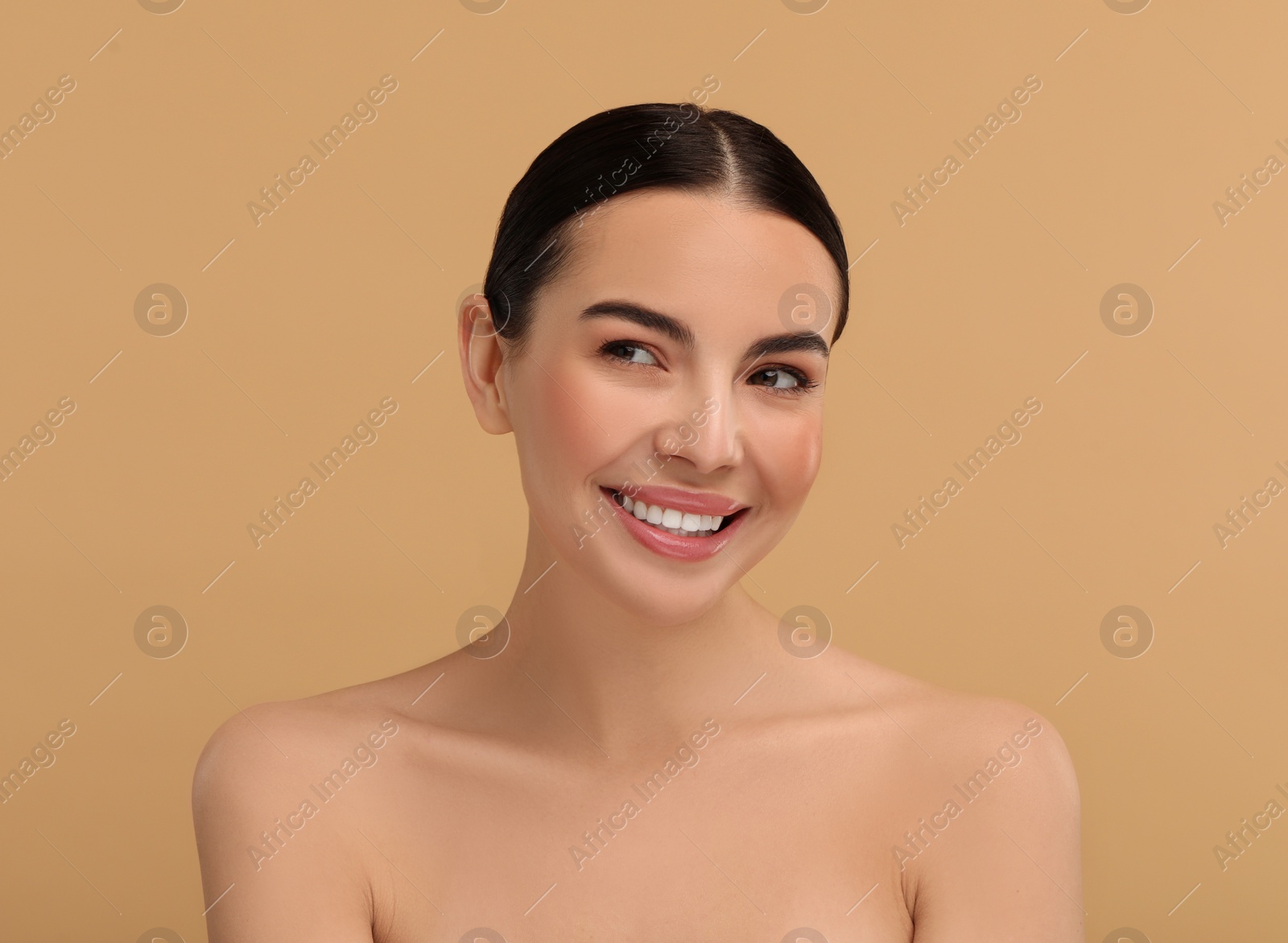 Photo of Beautiful woman with healthy skin on beige background. Space for text