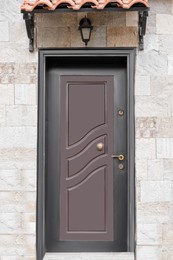 Photo of Entrance of building with beautiful modern door outdoors