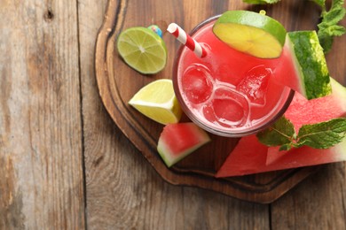 Delicious fresh watermelon drink on wooden table, top view