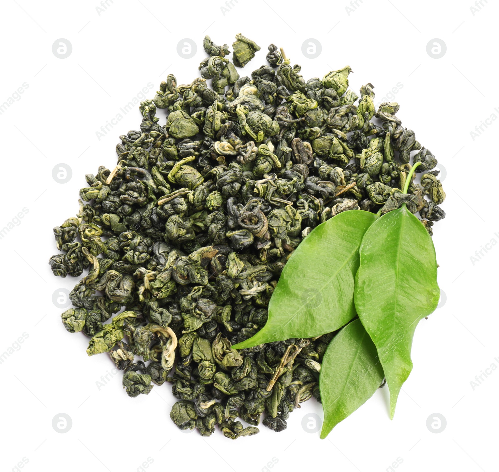 Photo of Pile of dried green tea leaves on white background, top view