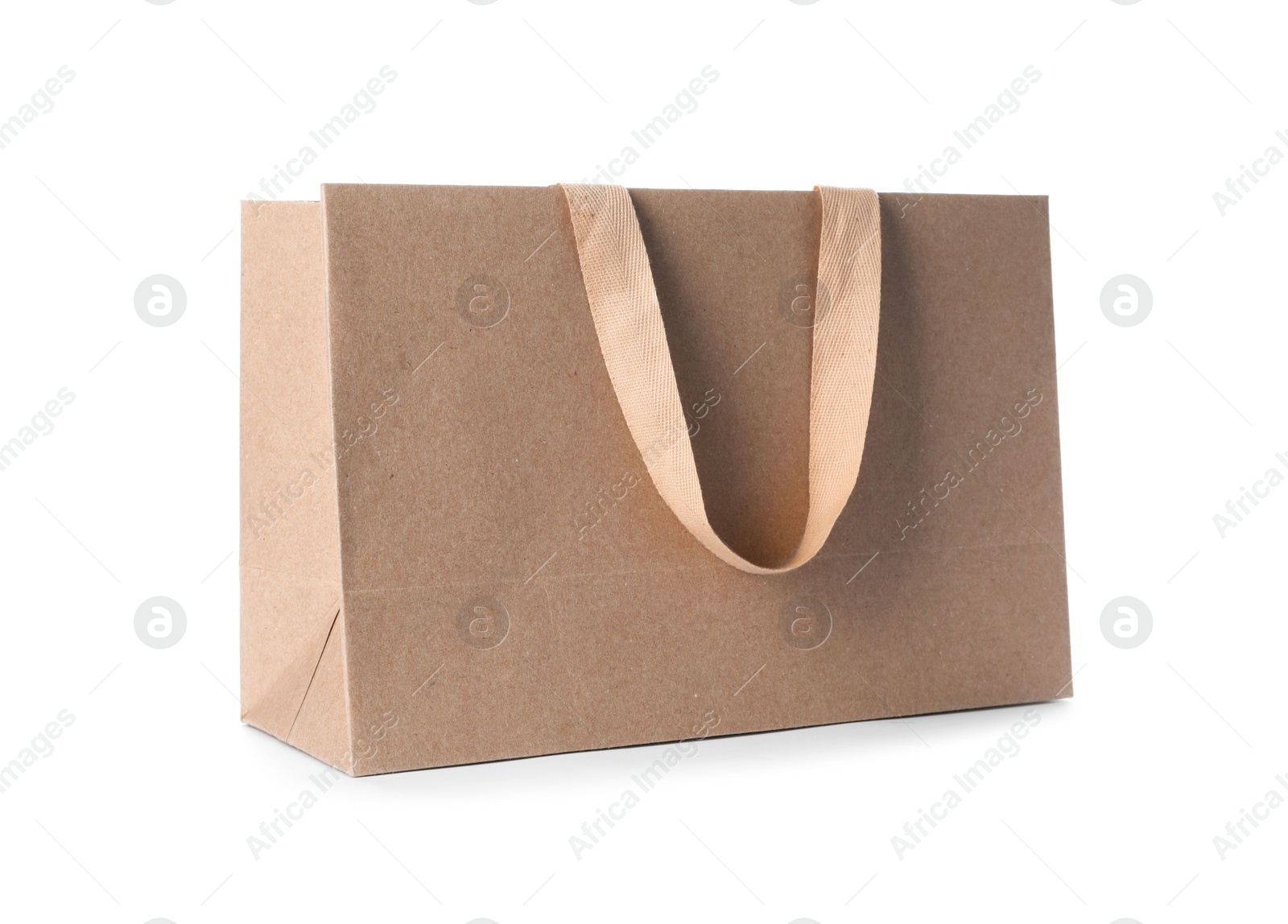 Photo of Paper shopping bag with comfortable handles on white background. Mockup for design