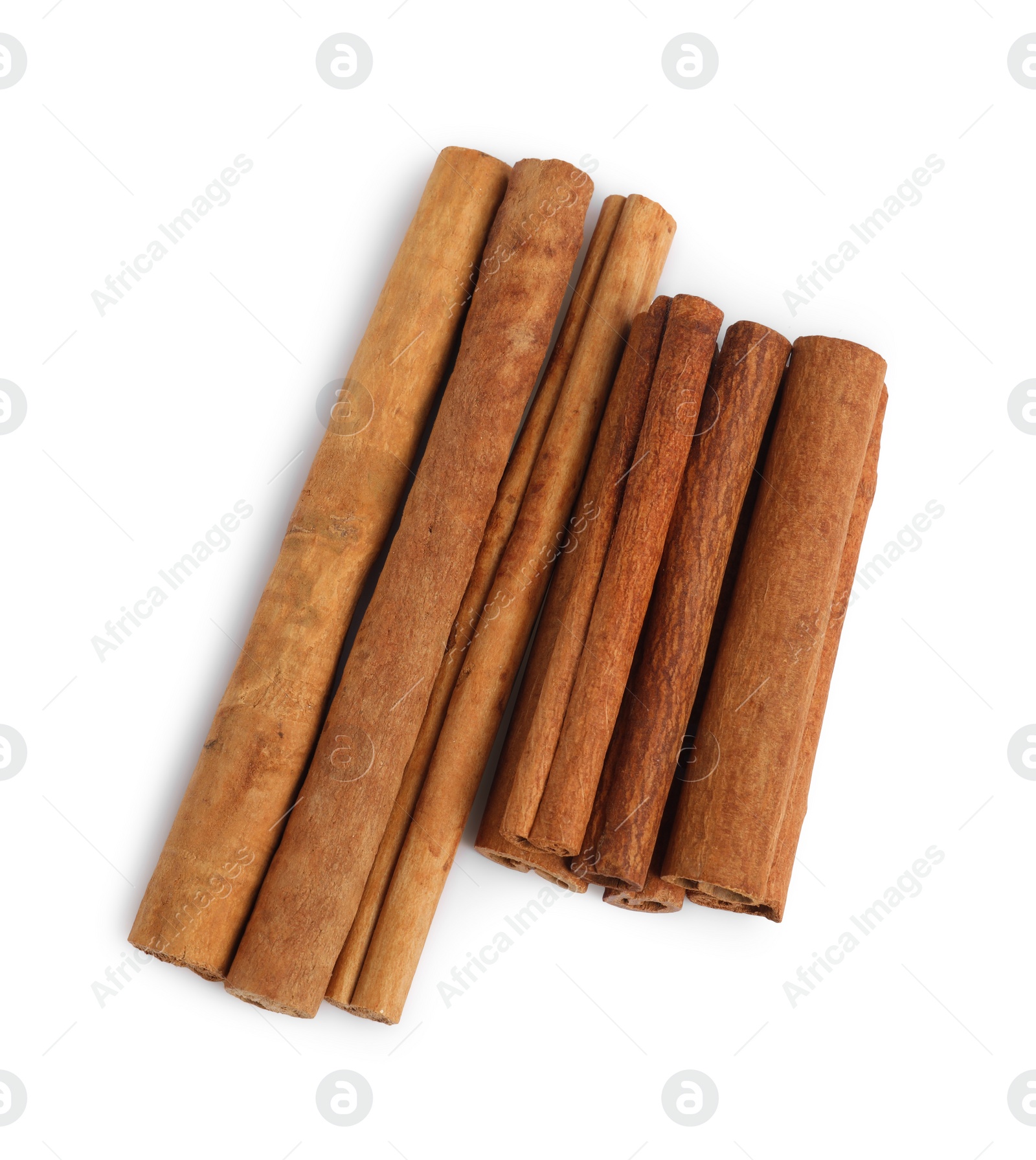 Photo of Dry aromatic cinnamon sticks isolated on white, top view