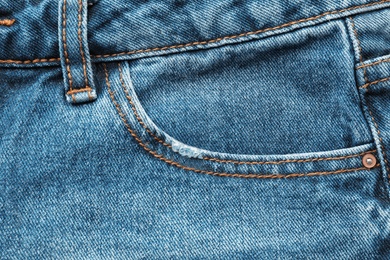 Photo of Closeup view of jeans pocket as background