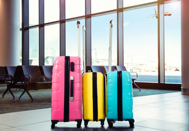Image of Travel suitcases in airport terminal. Summer vacation