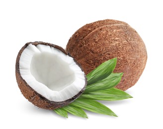 Image of Tasty ripe coconuts and green leaves on white background
